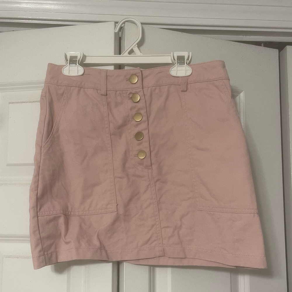Forever 21; light pink mini tight skirt; buttons in front; pockets;soft material